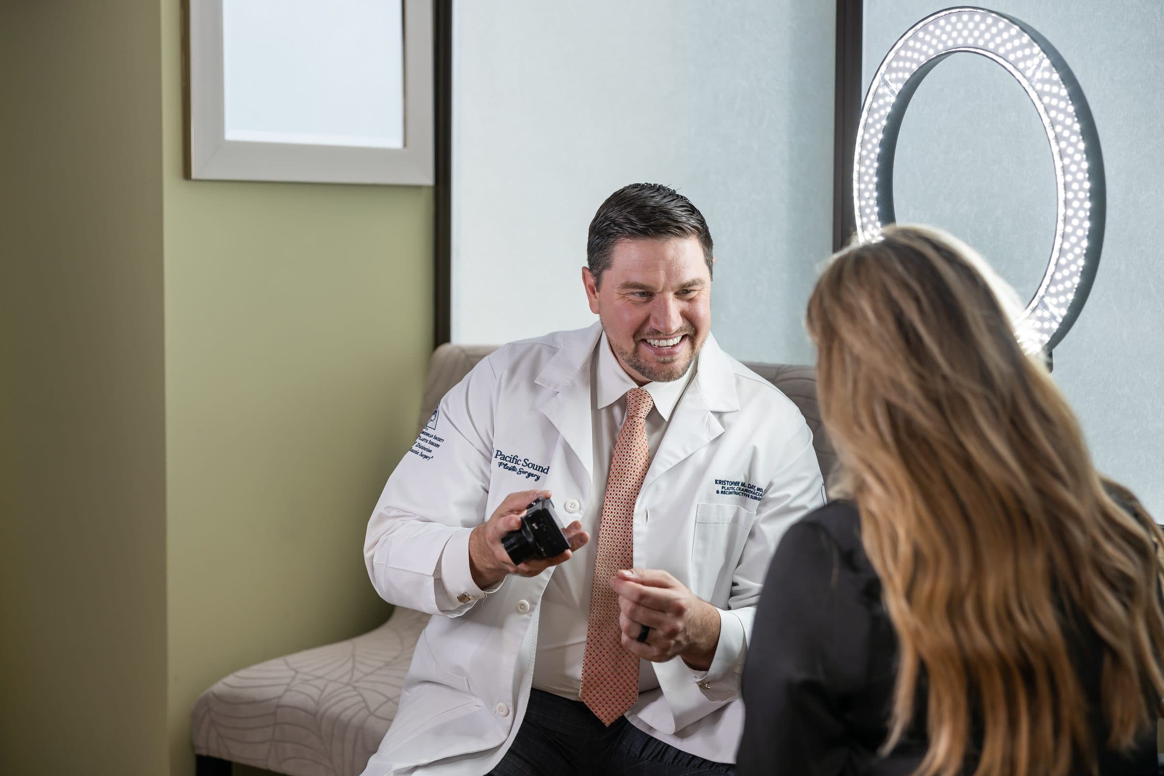 Dr. Day consulting with a patient in the medical spa at Pacific Sound Plastic Surgery