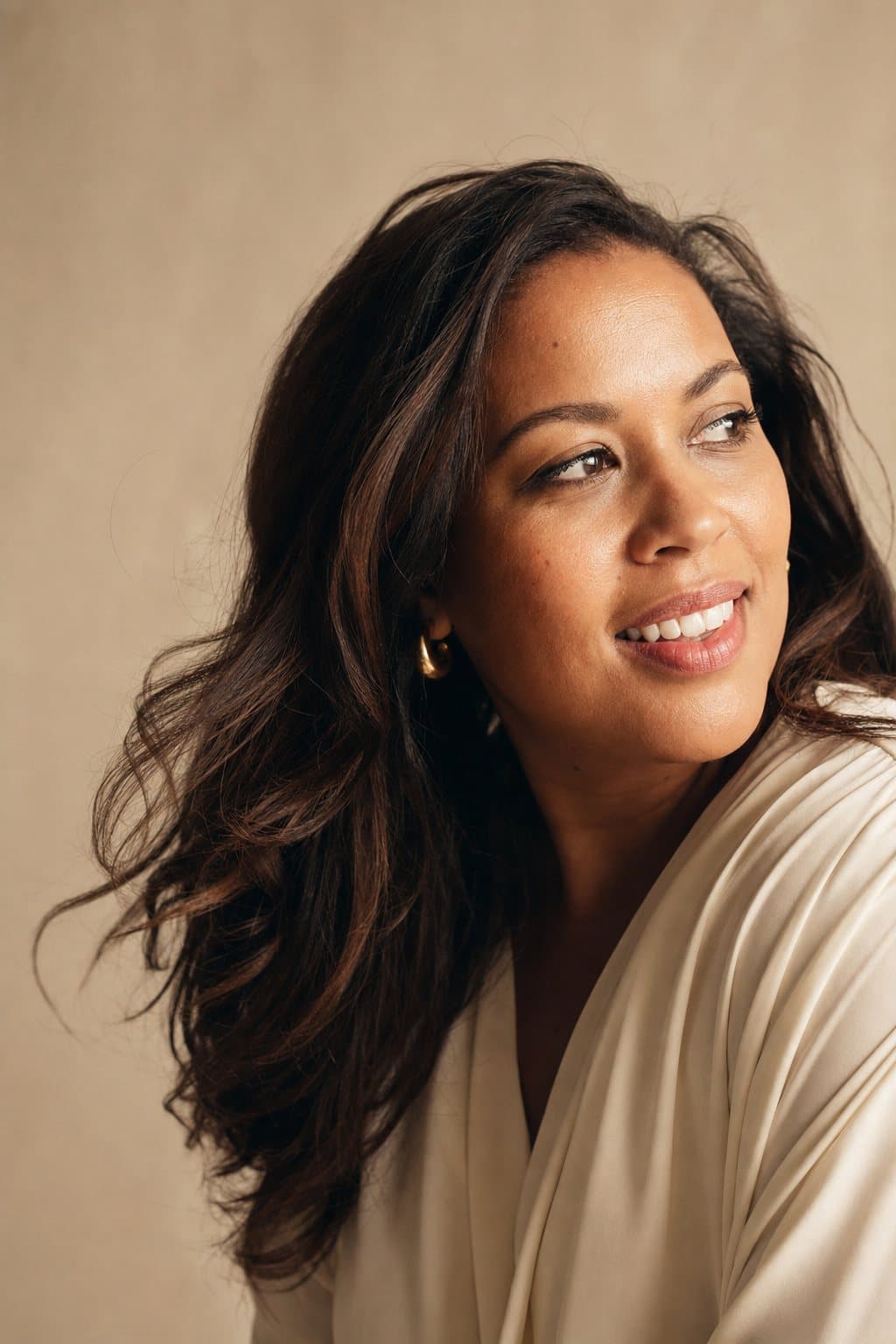 Rich healthy hair in motion, glowing skin. Illustrative image — not a patient.