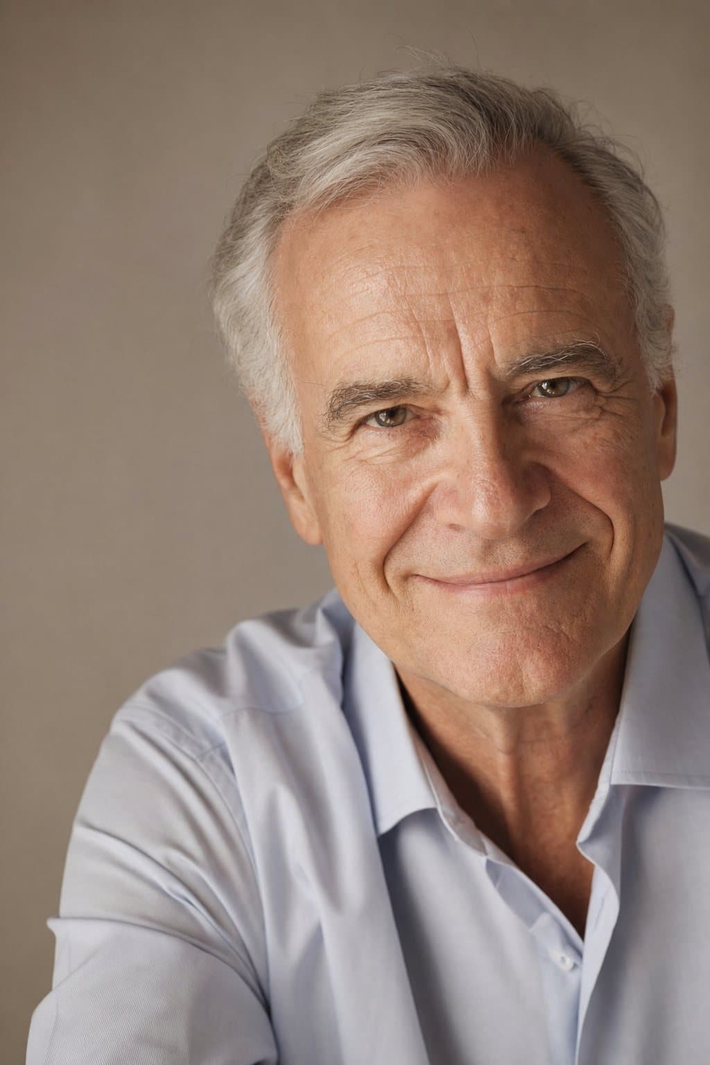 Warm portrait of a distinguished older man, reassured. Illustrative image — not a patient.